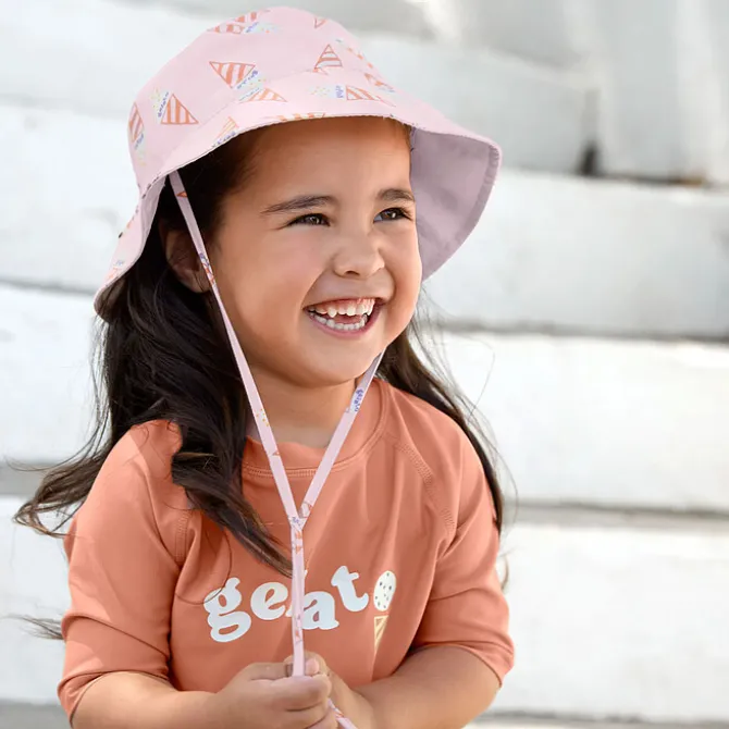 LÄSSIG Chapeau Anti-UV Réversible Ice Cream Rose Pâle - 7/12 Mois