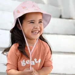 LÄSSIG Chapeau Anti-UV Réversible Ice Cream Rose Pâle - 3/6 Mois
